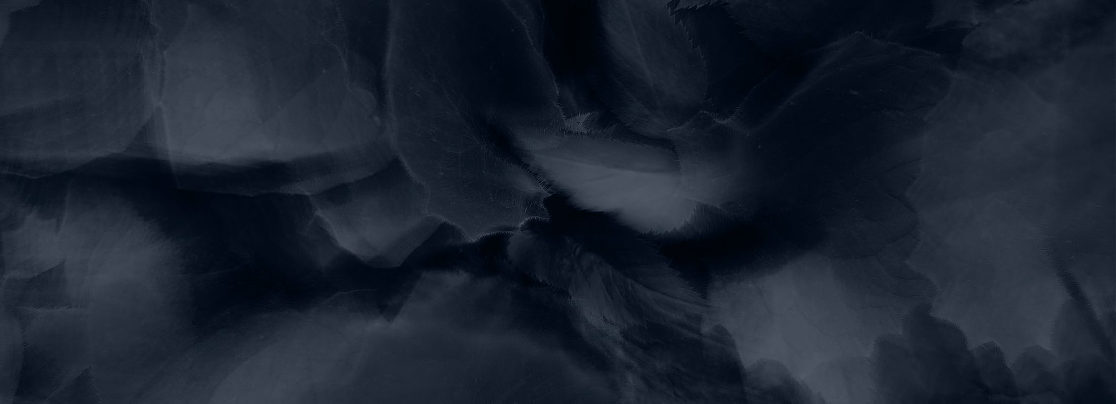 Abstract dark blue textured background.